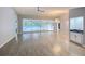 An open-concept living room overlooks the pool with wet bar, perfect for entertaining at 5708 Garden Lakes Fern, Bradenton, FL 34203