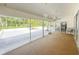 The sunroom has neutral carpet, a ceiling fan, a hanging light fixture and an outdoor view at 5708 Garden Lakes Fern, Bradenton, FL 34203