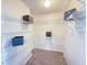 Spacious walk-in closet featuring custom wire shelving and wood-look tile flooring at 5708 Garden Lakes Fern, Bradenton, FL 34203
