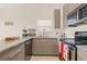Modern kitchen featuring stainless steel appliances, stylish cabinets, and ample counter space at 5727 Monte Rosso Rd, Sarasota, FL 34243