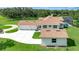 Spacious aerial view of home with a pool, detached garage, and large driveway at 5750 Saddle Oak Trl, Sarasota, FL 34241