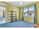 Bedroom with a ceiling fan and large window at 5750 Saddle Oak Trl, Sarasota, FL 34241