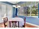 Charming dining area with a round table, elegant chairs, and a window view to outside at 5750 Saddle Oak Trl, Sarasota, FL 34241