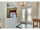 Welcoming entryway with decorative glass doors, tiled floors, and elegant lighting fixtures at 5750 Saddle Oak Trl, Sarasota, FL 34241