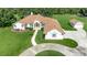 Expansive single-story home featuring a circular driveway and lush landscaping at 5750 Saddle Oak Trl, Sarasota, FL 34241