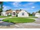 A charming single-story home with a circular driveway, well-manicured lawn, and detached garage at 5750 Saddle Oak Trl, Sarasota, FL 34241
