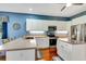 Modern kitchen featuring white cabinets, stainless steel appliances, and ample counter space at 5750 Saddle Oak Trl, Sarasota, FL 34241