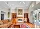 Inviting living room boasts a cozy fireplace, built-in shelves, and a warm, inviting atmosphere at 5750 Saddle Oak Trl, Sarasota, FL 34241