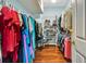 Walk-in closet with shelving and hanging storage, providing ample space for organization at 5750 Saddle Oak Trl, Sarasota, FL 34241
