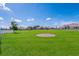 Expansive community green space offers a picturesque and inviting area for outdoor recreation and enjoyment at 7108 Playa Bella Dr, Bradenton, FL 34209