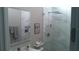 Modern bathroom showcasing a frameless glass shower and sleek vanity with integrated mirror at 7323 Great Egret Blvd, Sarasota, FL 34241