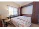 This bedroom features a Murphy bed, desk, and lots of natural light from the window at 8503 Gateway Ct, Englewood, FL 34224