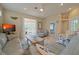 Comfortable living room with access to a sunroom, offering plenty of natural light and space at 8503 Gateway Ct, Englewood, FL 34224