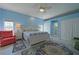Comfortable main bedroom with king bed, ceiling fan, and ample closet space offers a serene retreat at 8503 Gateway Ct, Englewood, FL 34224