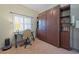 Office with a large built in cabinet, a work space and lots of natural light at 8503 Gateway Ct, Englewood, FL 34224
