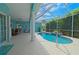 Relaxing outdoor space featuring a screened-in pool and ample seating area for entertaining at 8503 Gateway Ct, Englewood, FL 34224