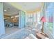 Bright sunroom with comfortable seating offers a relaxing space with natural light at 8503 Gateway Ct, Englewood, FL 34224