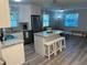 This open concept home features a kitchen with granite countertops and a living room with plenty of light at 1041 S Tuttle Ave, Sarasota, FL 34237
