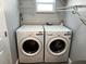 Laundry room featuring modern washer and dryer units with easy access and functional layout at 1041 S Tuttle Ave, Sarasota, FL 34237