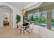 Charming breakfast nook with tile floors and natural light, overlooking the outdoor pool area at 10912 Big Bass Pl, Bradenton, FL 34212