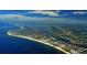 Expansive aerial view showcasing the coastline, waterways, and residential areas, highlighting the community's prime location at 1125 W Peppertree Dr # 706, Sarasota, FL 34242