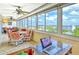 Bright balcony with a scenic view, dining set, and a comfortable workspace at 1125 W Peppertree Dr # 706, Sarasota, FL 34242