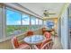 Enclosed sunroom with a desk and sweeping views of the city at 1125 W Peppertree Dr # 706, Sarasota, FL 34242