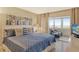 Serene bedroom with balcony access, comfortable bed, and bright, airy ambiance at 1125 W Peppertree Dr # 706, Sarasota, FL 34242