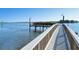 Scenic view of a waterfront community with a private wooden dock and beautiful water views at 1125 W Peppertree Dr # 706, Sarasota, FL 34242