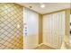 Condo entryway with patterned wallpaper, a closet, and tile flooring at 1125 W Peppertree Dr # 706, Sarasota, FL 34242