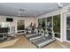 Fully-equipped fitness center with treadmills, weight machines, and bright natural light at 1125 W Peppertree Dr # 706, Sarasota, FL 34242