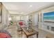 Cozy living room with tile floors, comfortable seating, and built-in entertainment center at 1125 W Peppertree Dr # 706, Sarasota, FL 34242