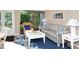 Relaxing living room with comfortable sofa, armchair, and stylish decor, creating a cozy atmosphere at 1125 W Peppertree Dr # 706, Sarasota, FL 34242