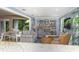 Inviting living room with a wall-to-wall bookcase and comfortable seating area at 1125 W Peppertree Dr # 706, Sarasota, FL 34242