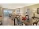 Open-concept living and dining area with neutral colors and a view of the city at 1125 W Peppertree Dr # 706, Sarasota, FL 34242