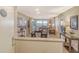 Open-concept living and dining area with neutral colors and a view of the city at 1125 W Peppertree Dr # 706, Sarasota, FL 34242