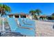 Inviting pool deck featuring lounge chairs for relaxing poolside at 1125 W Peppertree Dr # 706, Sarasota, FL 34242