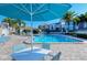 Community pool featuring ample seating and stunning views of the surrounding landscaping at 1125 W Peppertree Dr # 706, Sarasota, FL 34242