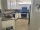 Beautiful kitchen features white cabinetry, stainless steel appliances, granite countertops, and ample lighting at 12229 Amica Loop, Venice, FL 34293