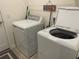 Laundry room features a full-size washer and dryer at 12229 Amica Loop, Venice, FL 34293