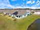 Aerial view of the backyard, showing the water and solar panels at 12518 Oak Hill Way, Parrish, FL 34219