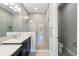 Bright bathroom features a large tiled walk-in shower with dual shower heads at 12518 Oak Hill Way, Parrish, FL 34219