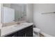 Bathroom featuring dark vanity and a large mirror at 12518 Oak Hill Way, Parrish, FL 34219