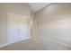 Spacious bedroom featuring neutral carpet, a double door closet, and a second entrance to another area at 12518 Oak Hill Way, Parrish, FL 34219