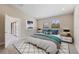 Bright bedroom with a large bed, stylish rug, and sliding glass doors leading to the outside at 12518 Oak Hill Way, Parrish, FL 34219