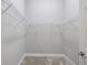 A walk-in closet with carpeted floors, white walls, and metal shelving at 12518 Oak Hill Way, Parrish, FL 34219