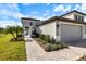 Beautiful single-Gathering home with a manicured lawn and inviting entryway at 12518 Oak Hill Way, Parrish, FL 34219