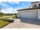 Paver driveway leads up to the two-car garage at 12518 Oak Hill Way, Parrish, FL 34219