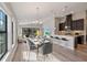 Open living space with kitchen, dining, and sitting area, with natural light at 12518 Oak Hill Way, Parrish, FL 34219
