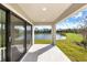 Covered patio with lake view, perfect for relaxing and enjoying the outdoors at 12518 Oak Hill Way, Parrish, FL 34219